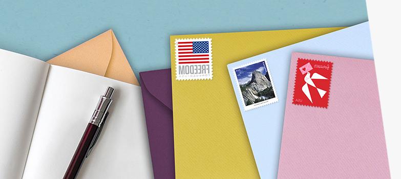 Assortment of colored envelopes with the Love, Waterfalls, and U.S. Flag First-Class Mail Forever stamps.
